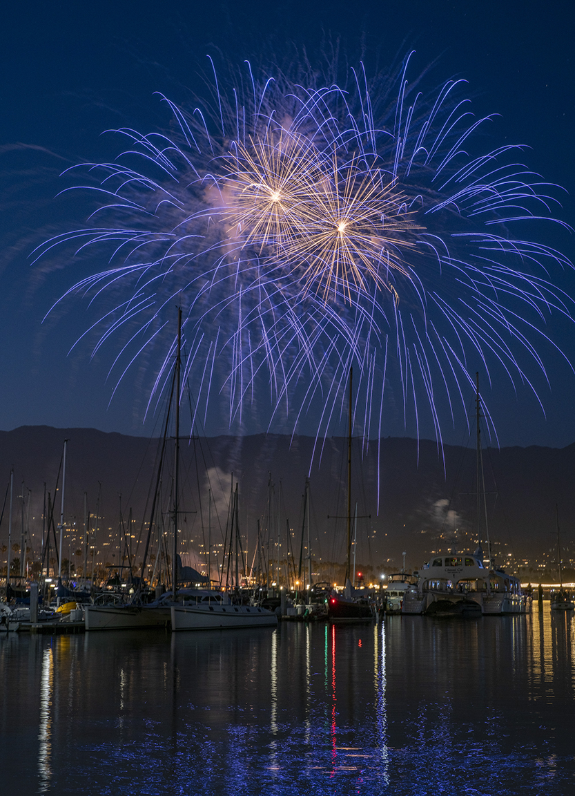 Fireworks explode over harbor