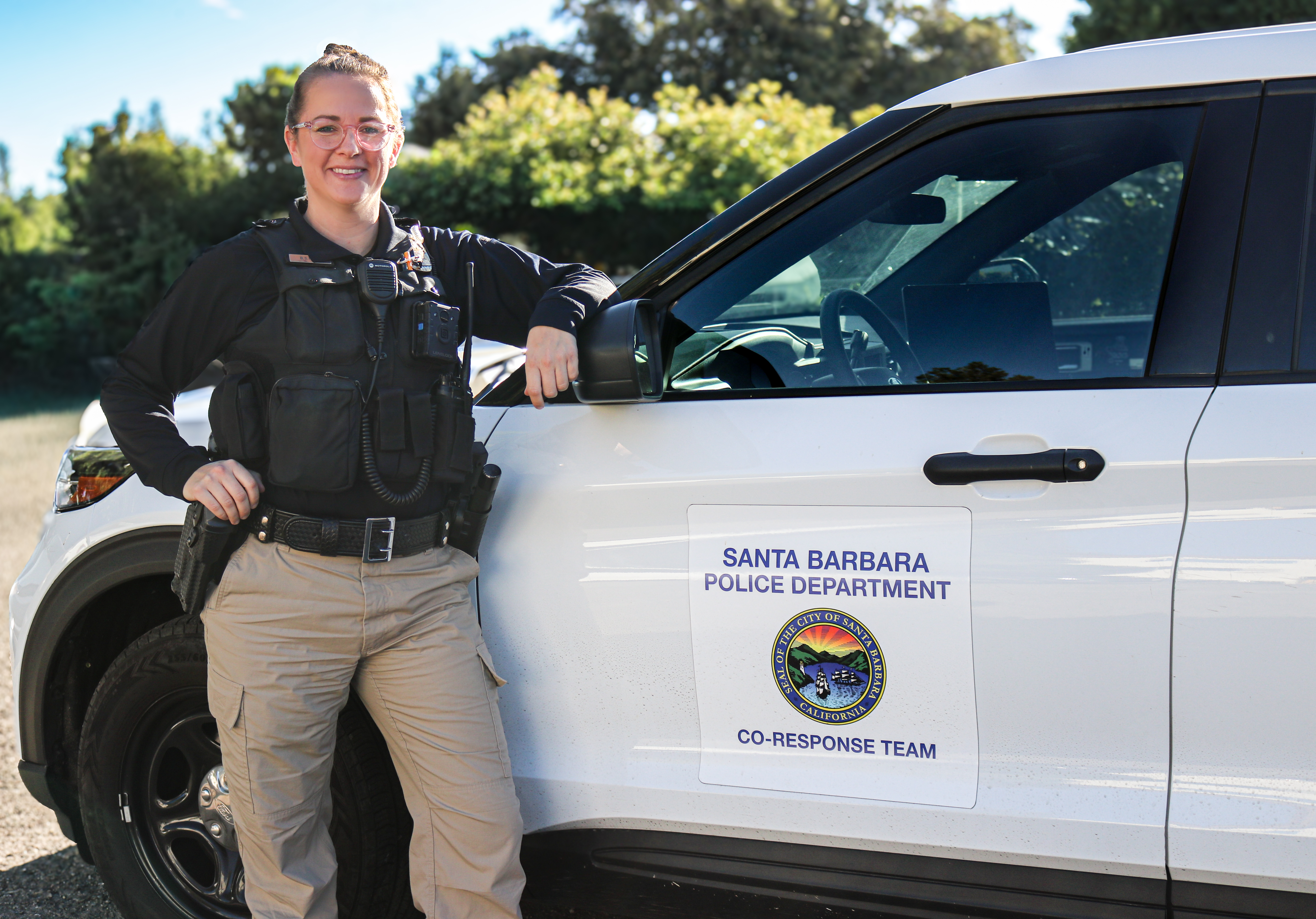 Co-Response officer in front of vehicle
