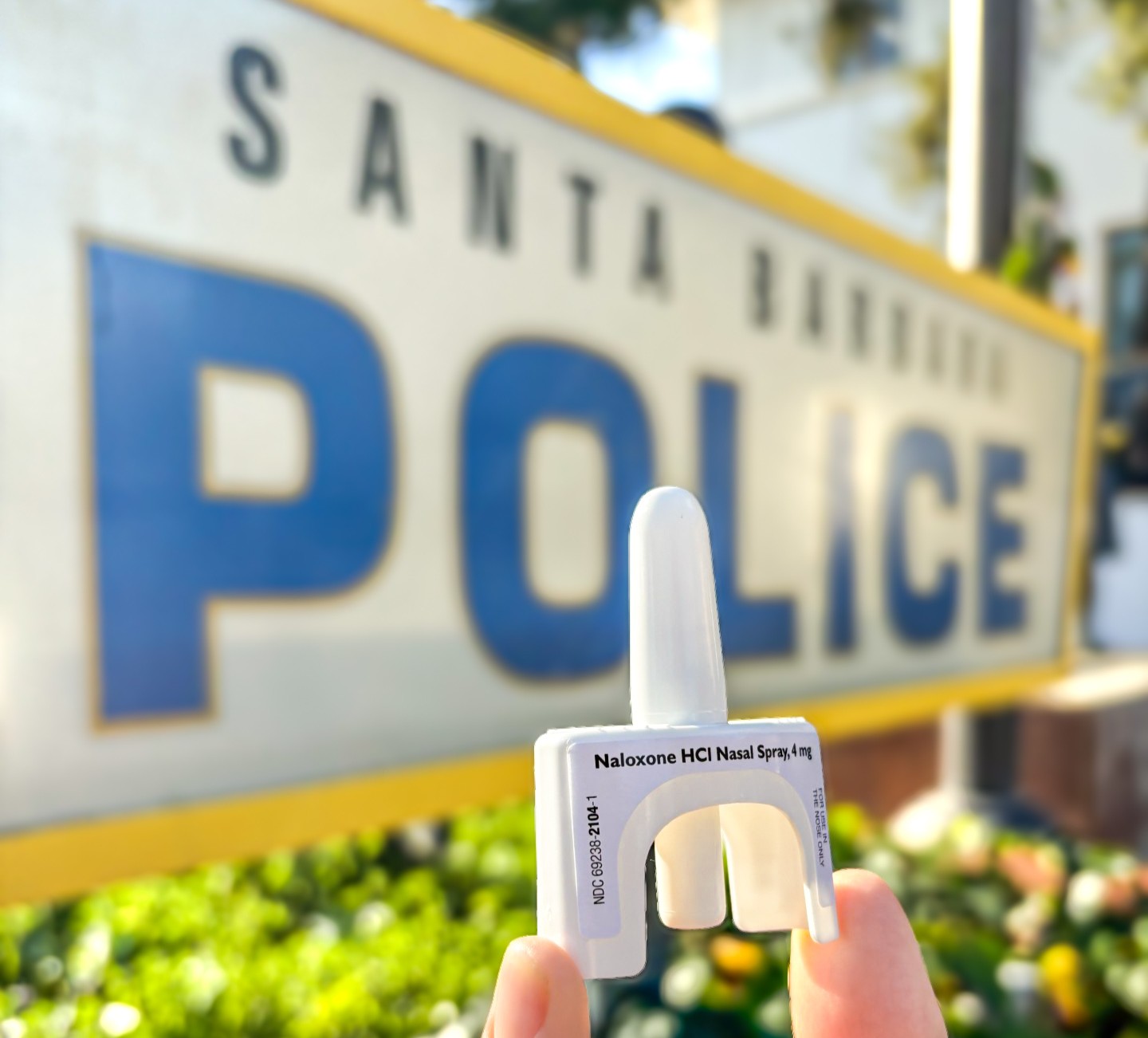 Naloxone in front of SBPD sign