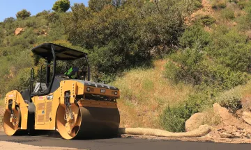 Roller paving a street