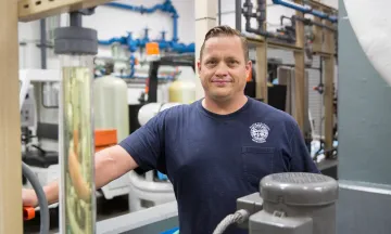 Cater Water Treatment Plant Employee smiling while working at the facility