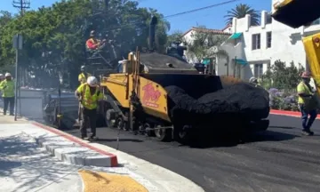 City crews work on a pavement project with equipment 