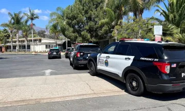 Parked Police Vehicles Bishop Diego HS