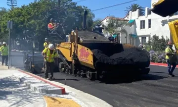 Construction crew paving a City street