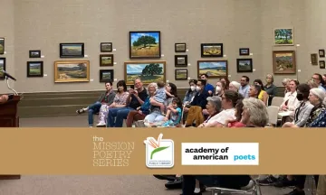 A person speaking at a podium in front of an audience.