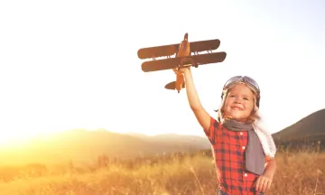 Young Boy with Toy Plane