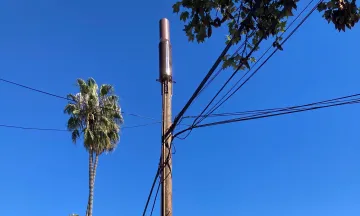 WOOD UTILITY POLE WITH SMALL CELL ON TOP