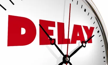 Clock with the word "Delay" in red