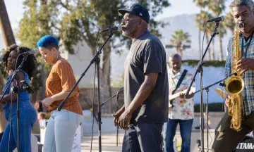 Musical group playing music in the park. 