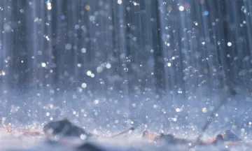 Closeup of rain hitting the ground