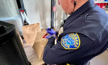 Officer booking evidence