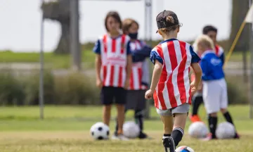 children playing soccer 