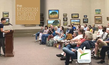 Image shows a lecturer addresses a large crowd in the Faulkner Gallery with a tan and white graphic that reads "Mission Poetry Series"