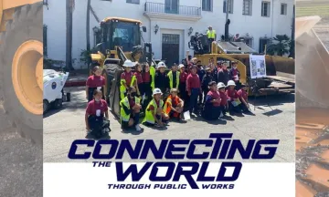 Image shows school children smiling in front of Public Works dozers at last year's event