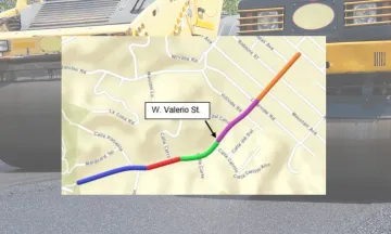 Image shows a map of W Valerio Street with yellow paving machines in the background