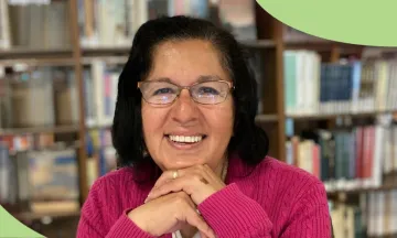 Photo of a Career Online High School graduate wearing a pink sweater