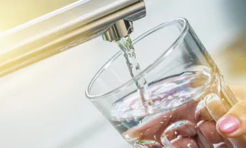 Image of a glass at a faucet