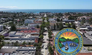 Aerial view of the City and State St going all the way to the ocean with a City Seal in the lower righthand corner