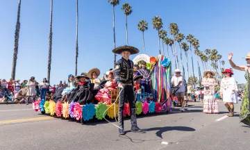 Children's Fiesta Parade colorful float with participants all smiles.