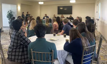 Students at the 2023 Youth Speak Out event listen carefully to one another