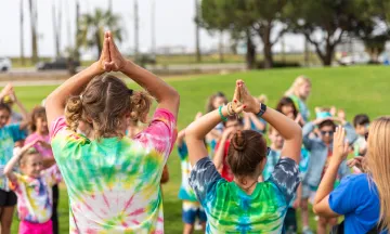 Nature Camp Counselors leading a group at a park