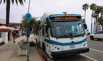 MTD's Downtown-Waterfront Shuttle stopped along the sidewalk.