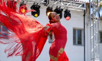 Flamenco dancer wearing a red dress.