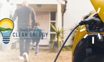 Close up of electric vehicle charger and people walking into a home in the background with Santa Barbara Clean Energy logo