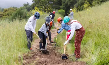 Volunteer trail workers level the dirt on Jesusita Trail