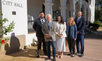 2024 City Council members standing in front of commemorative City Hall Centennial plaque 