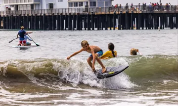 Participants at summer camp enjoy different water activities near Stearns Wharf