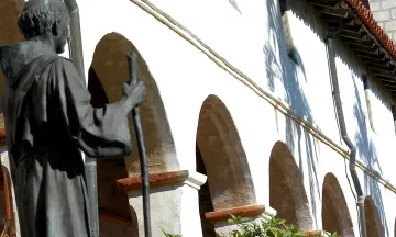 Statue in front of Arches at the Santa Barbara Mission