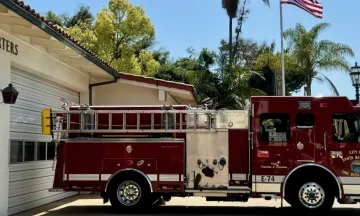 Santa Barbara City Fire Department Fleet Fire Truck at Headquarters with American Flag in the backgrpund