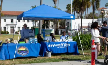 A family being welcomed by Public Works Employees to the Meet and Greet at De La Guerra Plaza.