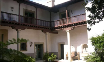 photo of second floor wooden balcony in courtyard