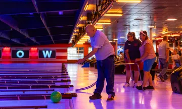 Program participant bowls at the Adapted Recreation Program