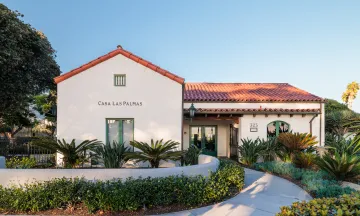 Casa Las Palmas entrance with walkway lined with plants