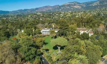 505 E Los Olivos Street. Photo of house and property on hill.