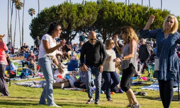 People dancing during Concerts in the Park at Chase Palm Park 