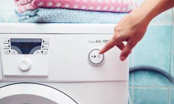 Front loader clothes washer with hand pressing buttons