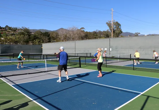 Community members play pickleball at the Municipal Tennis Courts