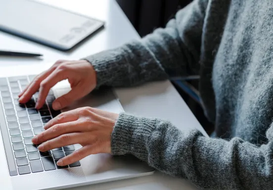 DigEplan News Item photo shows person on laptop to promote the new electronic plan review software