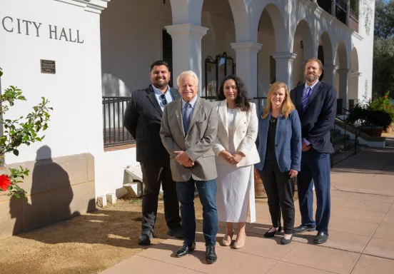 2024 City Council members standing in front of commemorative City Hall Centennial plaque 