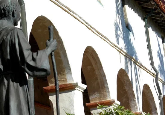 Statue in front of Arches at the Santa Barbara Mission