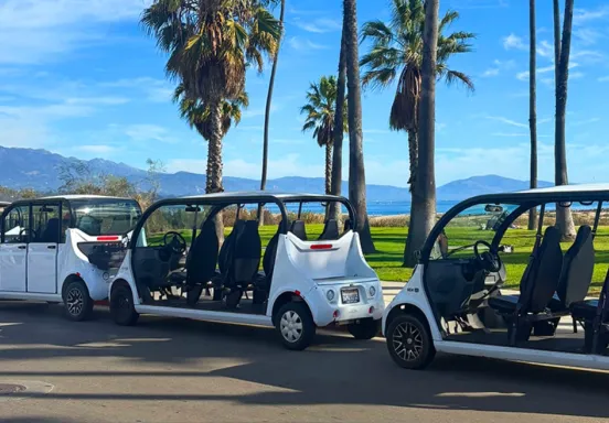 Three State Street Loop golf carts parked along Cabrillo Blvd.