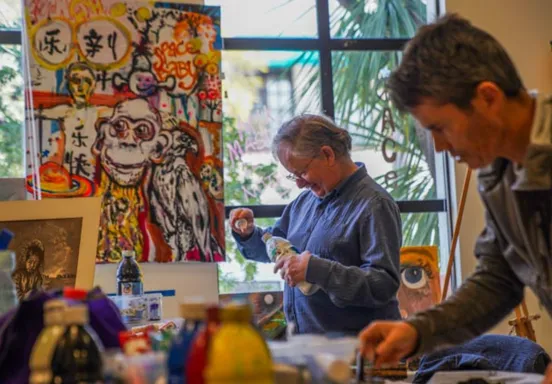 Participants painting at an activity of the Mental Wellness Center, a 2025-2026 grant recipient.