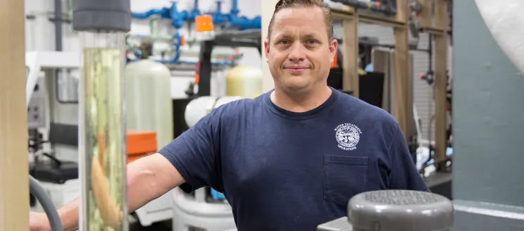 Cater Water Treatment Plant Employee smiling while working at the facility