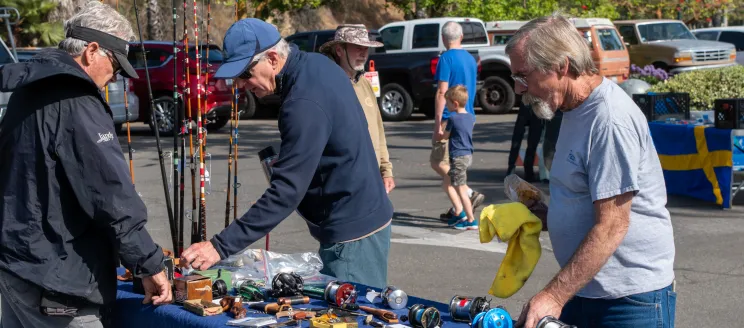 Men check out reels