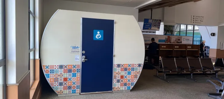 New Mamava Lactation Pod at the Airport, showcasing Spanish tile artwork on the outside of the freestanding dome-like structure