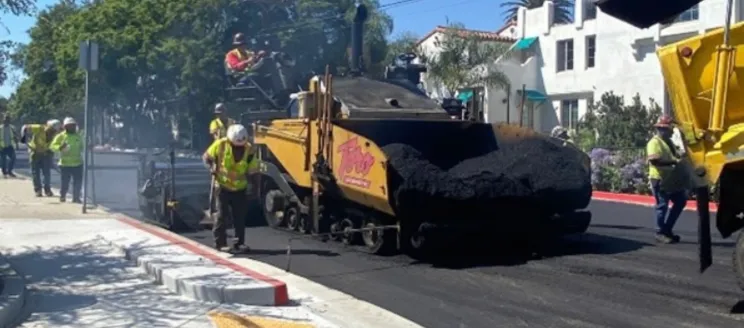 City crews work on a pavement project with equipment 